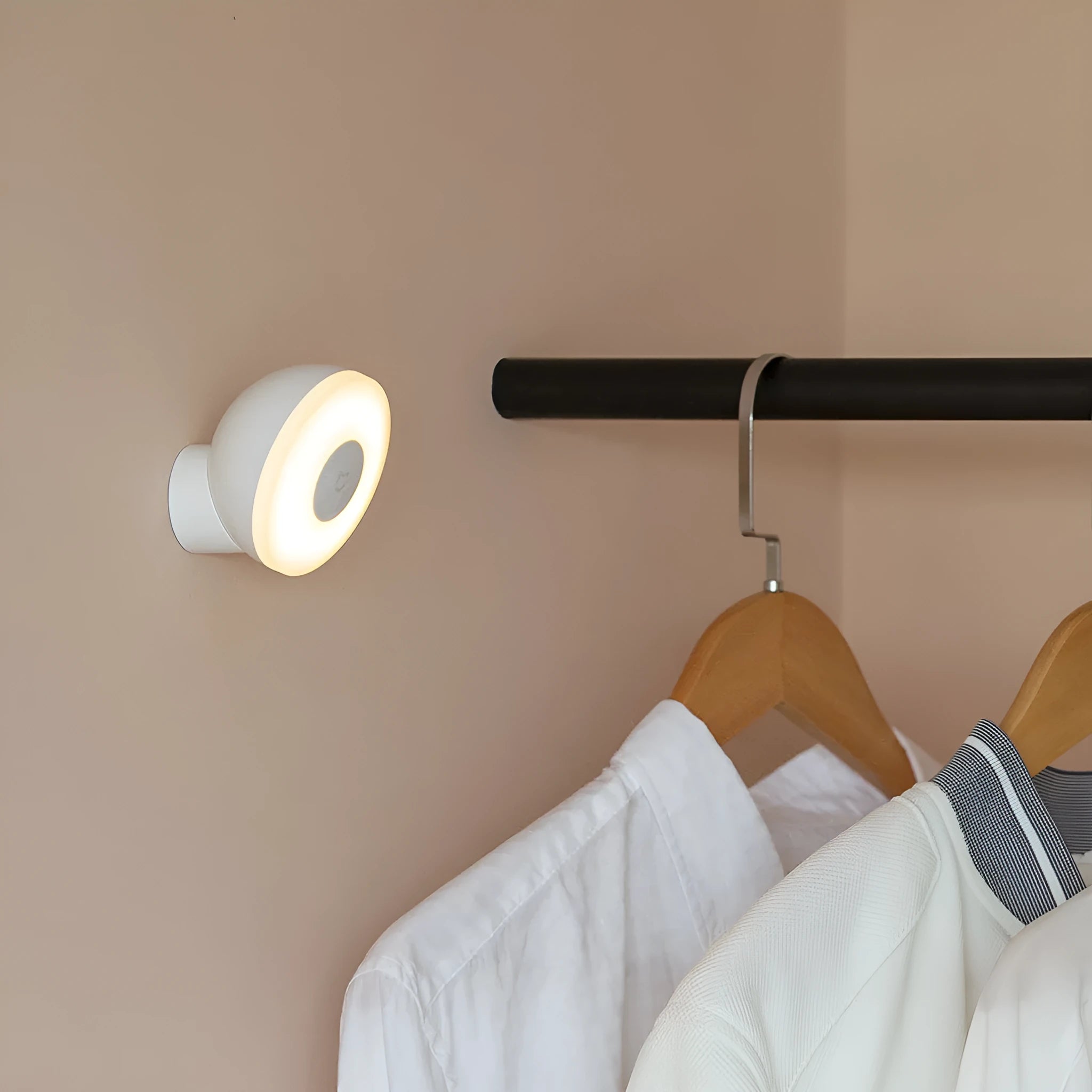 White modern bedside table lamp with human body induction and Bluetooth on a nightstand.