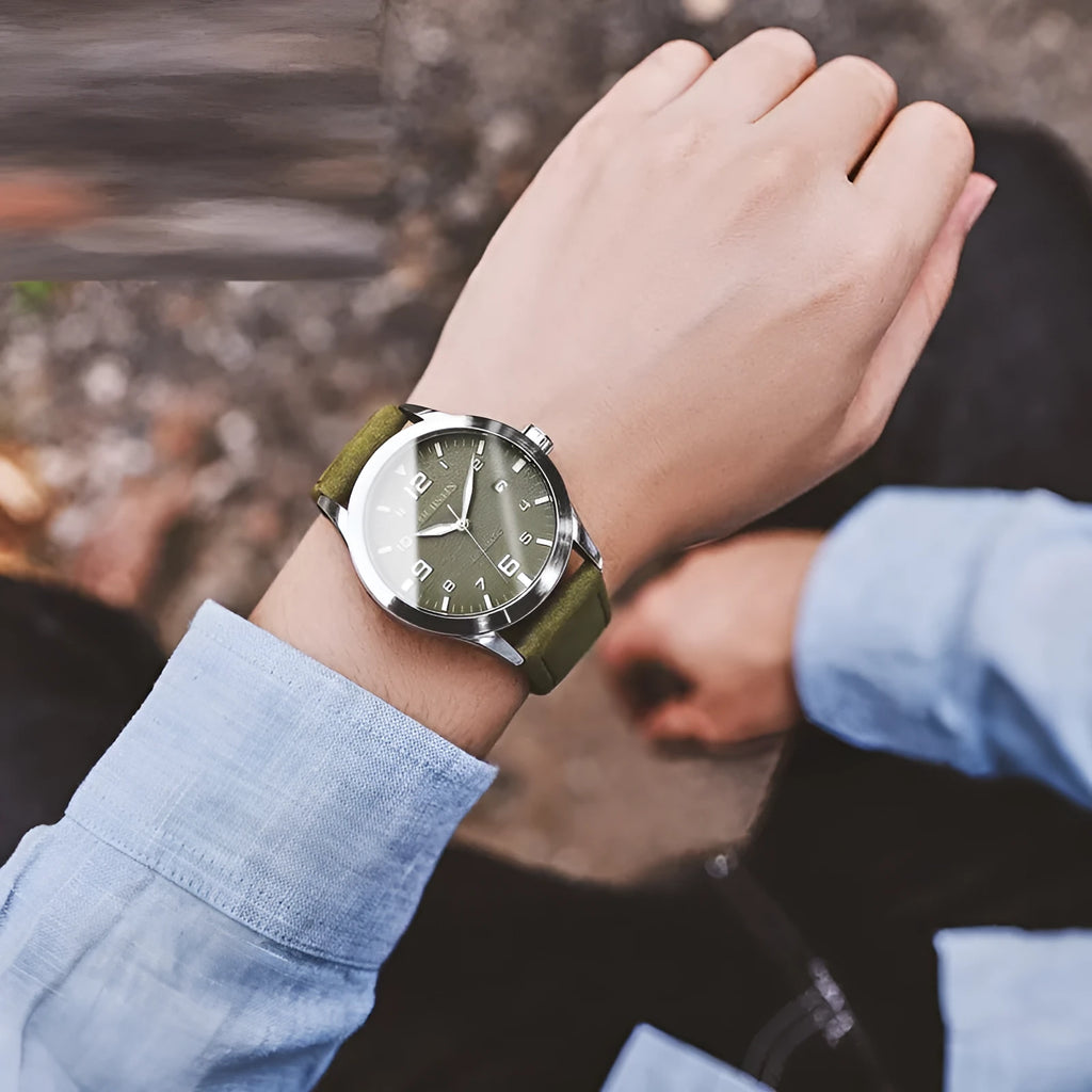 Men's automatic mechanical watch with leather strap on wrist, showing classic dial options.