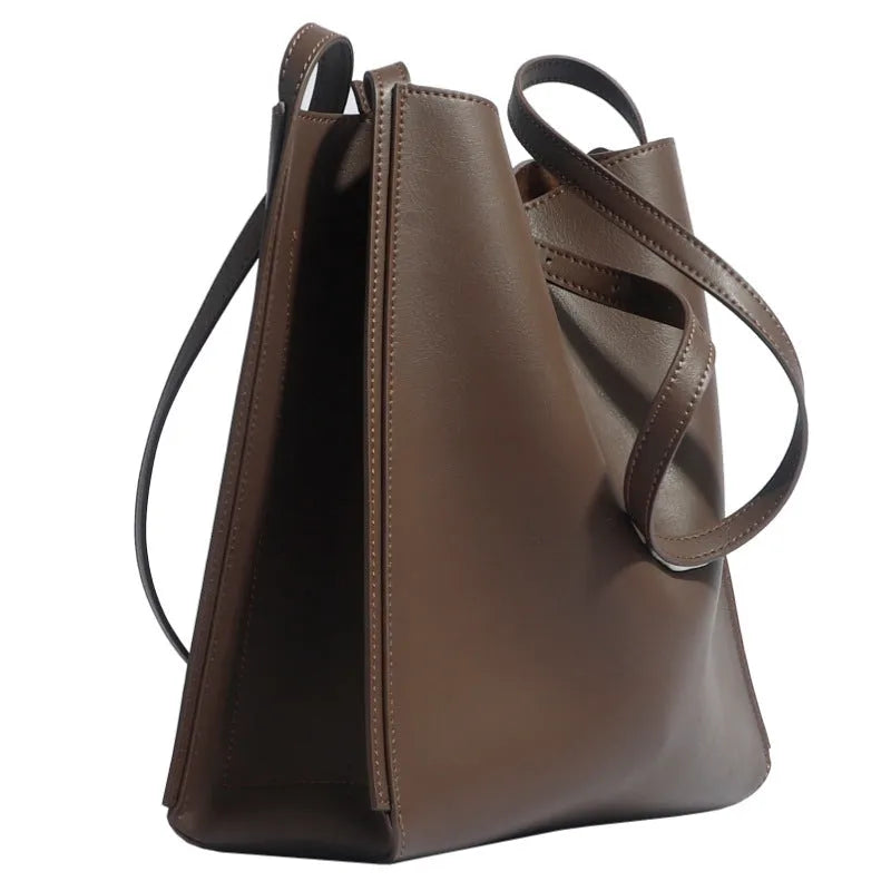 Genuine leather large capacity bucket shape women's handbag in brown with double shoulder straps and slit pocket
