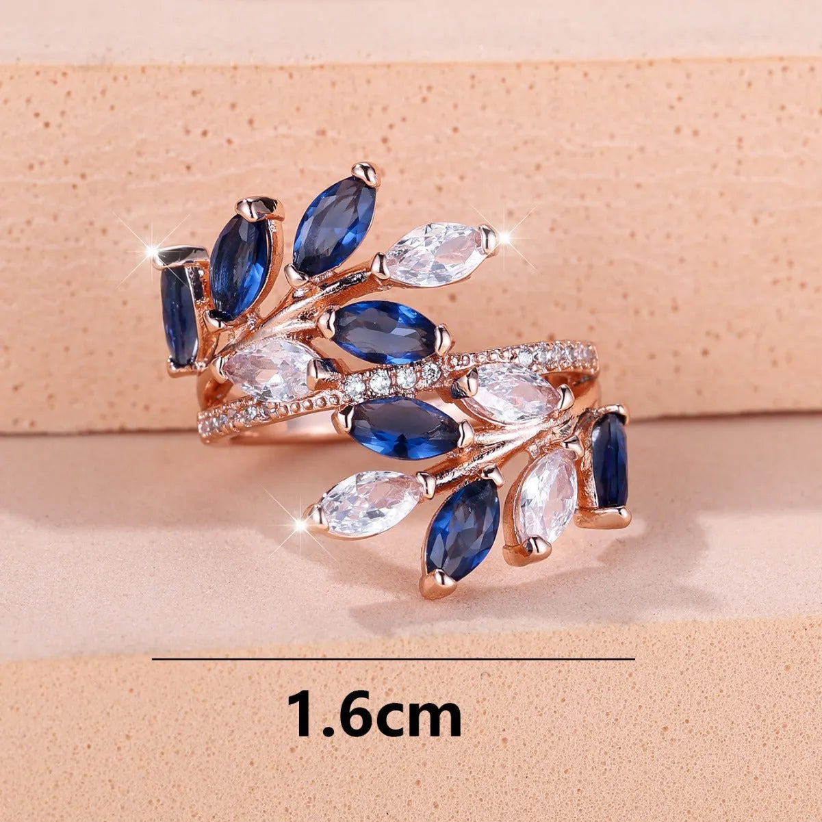 Adjustable copper leaf fashion ring with a central horse eye zircon stone, shown in a rose gold finish.