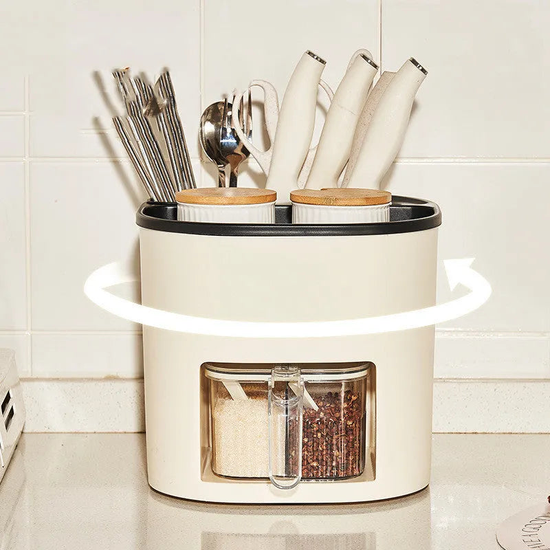 Plastic 360-degree rotating kitchen storage organiser with four compartments holding cutlery and a spice box