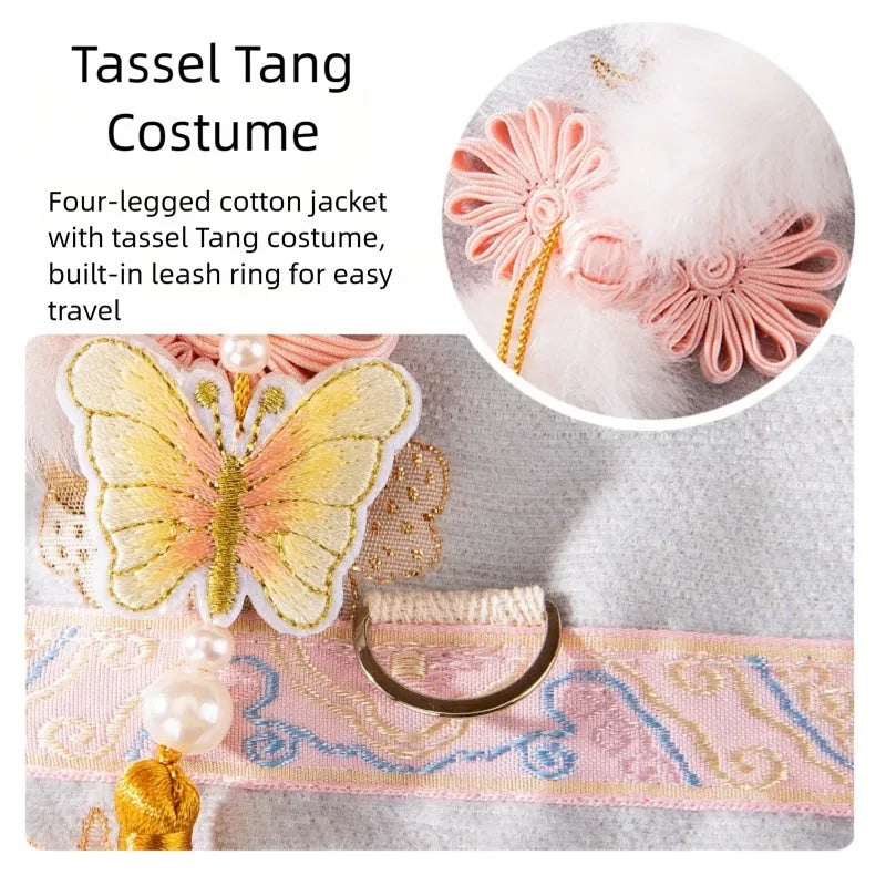 Light blue cheongsam pet coat with embroidered floral motifs, butterfly ornament, golden tassel, faux fur trim, and metal leash ring