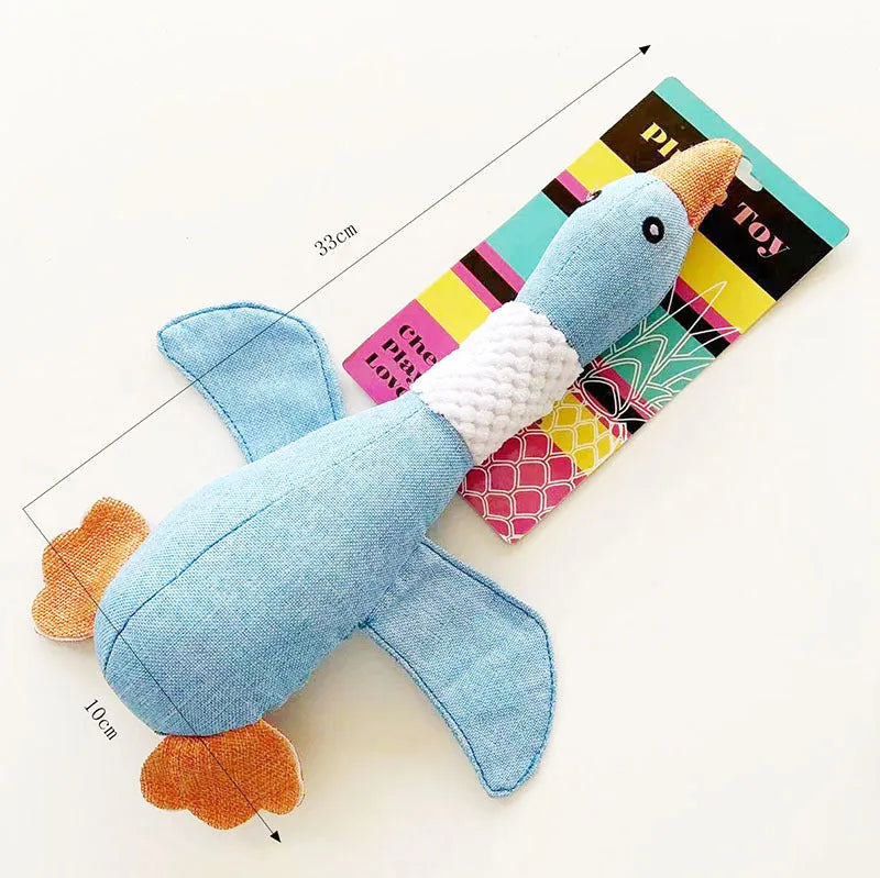 Blue durable duck plush dog toy with squeakers on a plain background
