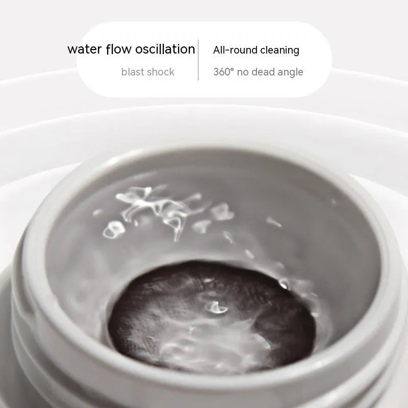 Pearl white automatic ultrasonic flushing instrument for cleaning invisible glasses on a table.