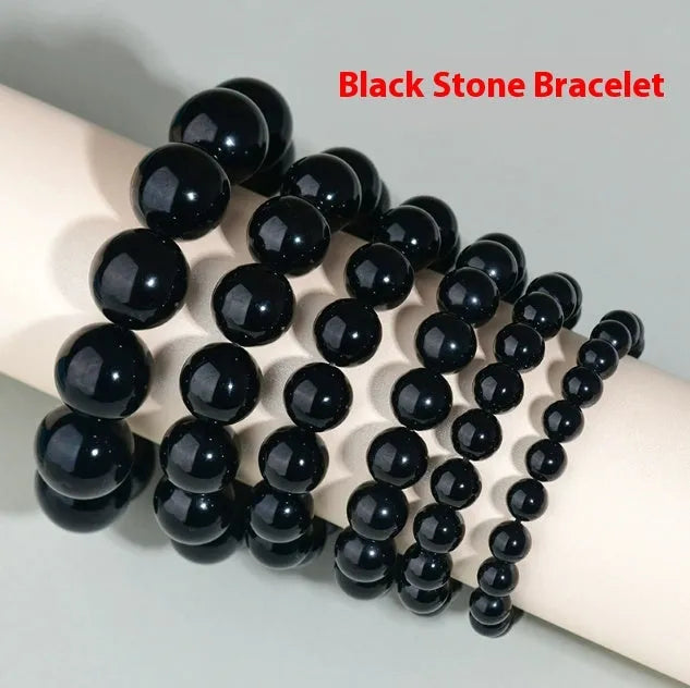 Hand-woven obsidian couples bracelet with year of birth engraving and multiple bead diameter options