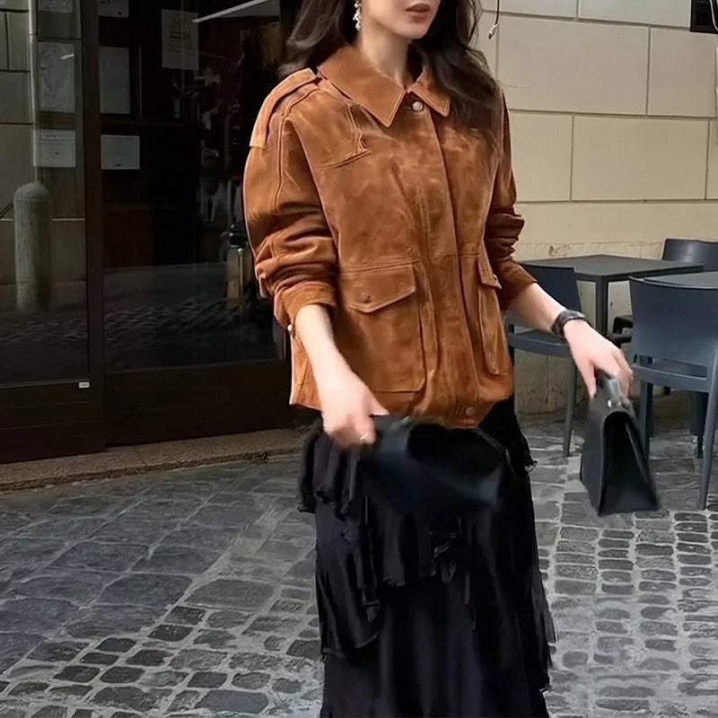 Women's brown suede-style street chic coat with regular sleeves on a hanger.