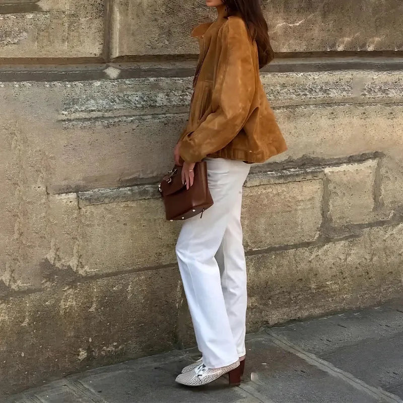 Retro solid colour loose fit polyester jacket on a hanger, showing long sleeves.