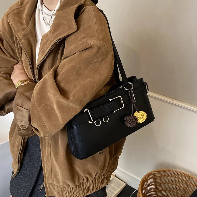 Women's retro belt buckle shoulder bag in PU, horizontal square shape, black or brown, with splicing detail.
