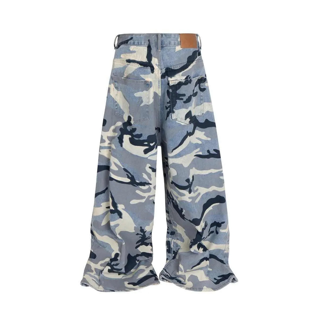 Snow camouflage blue loose fit denim jeans for men and women on a hanger.