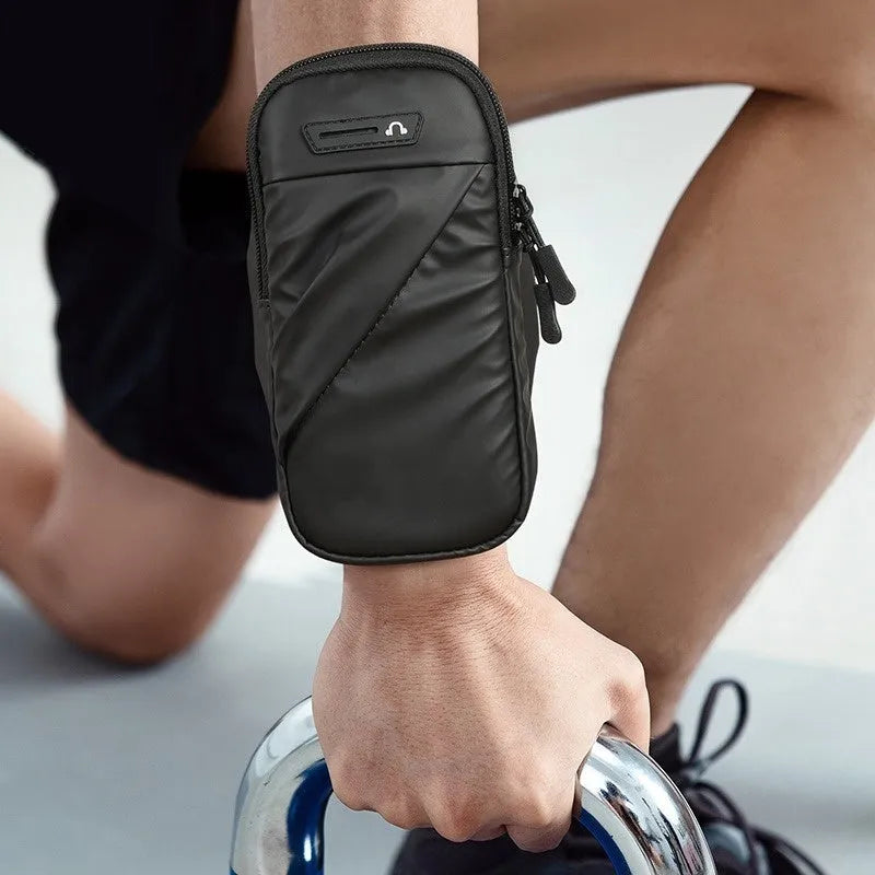Outdoor cycling arm sleeve phone pouch in black holding a 7.2 inch phone on a cyclist's arm