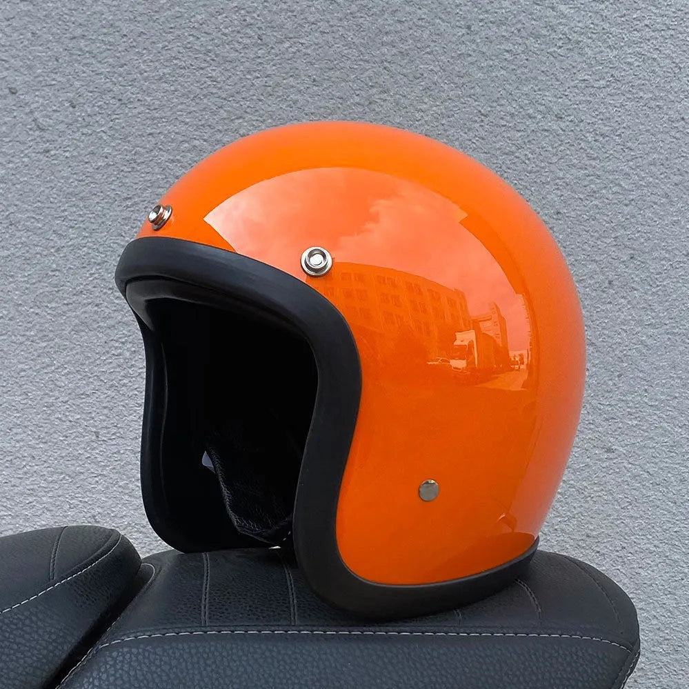 Retro-style motorcycle half helmet in cement grey with a glossy fibreglass shell on a plain background.