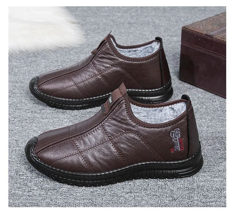 Men's brown winter cotton velvet boots with buckle fastening and a thick non-slip sole.