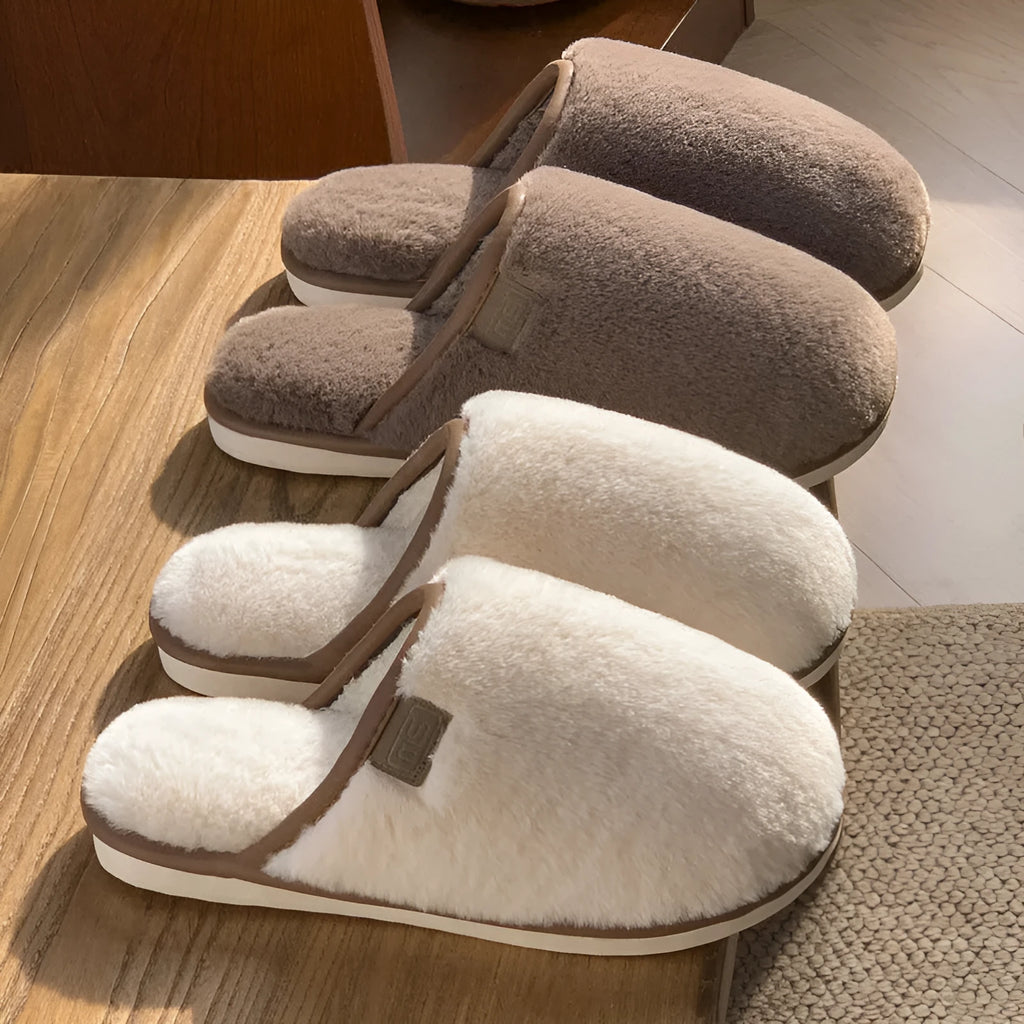 Pair of solid-colour plush PVC slippers with an overshoe design and a textured non-slip sole.