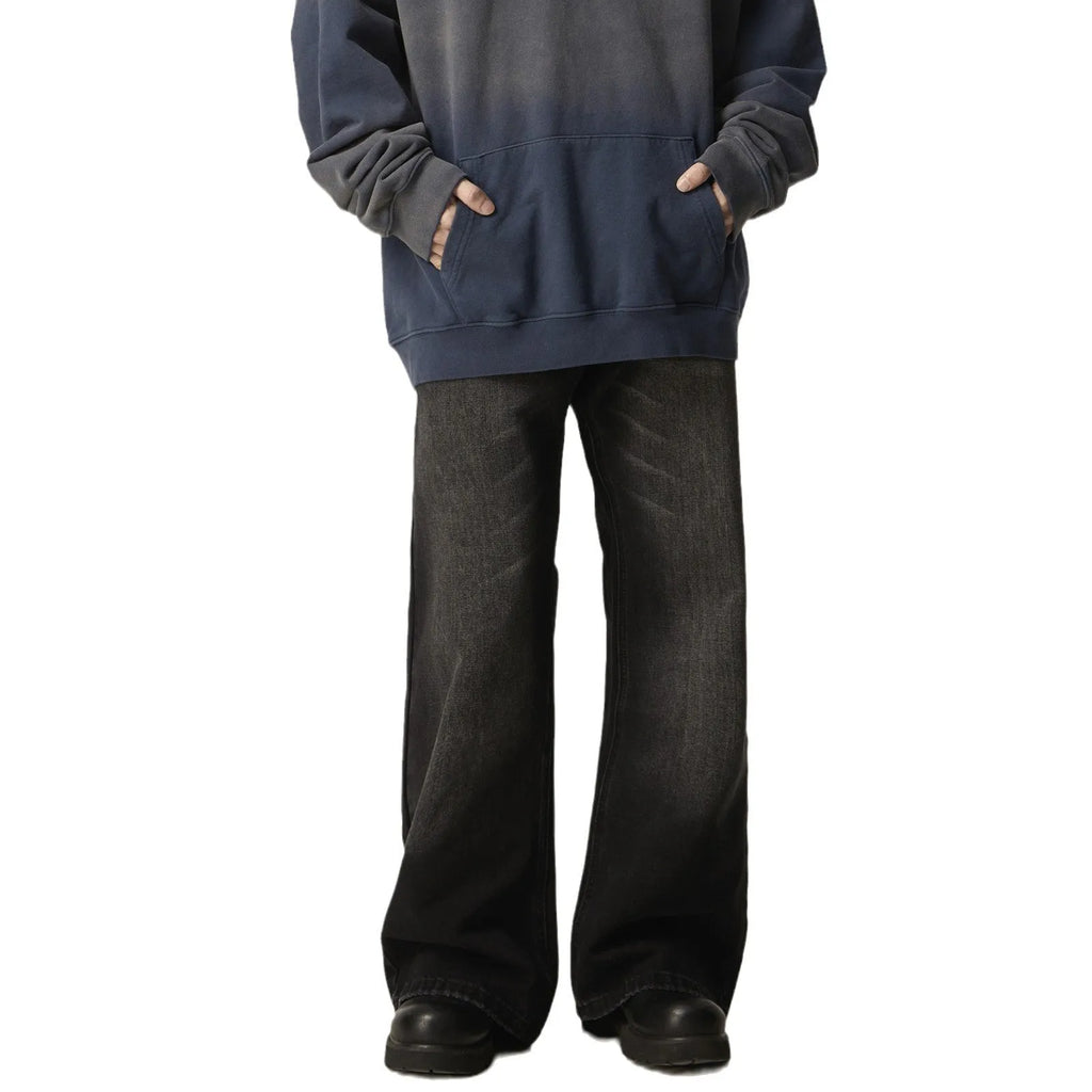 Man's black loose-fit straight-leg retro jeans made from polyester denim fabric.