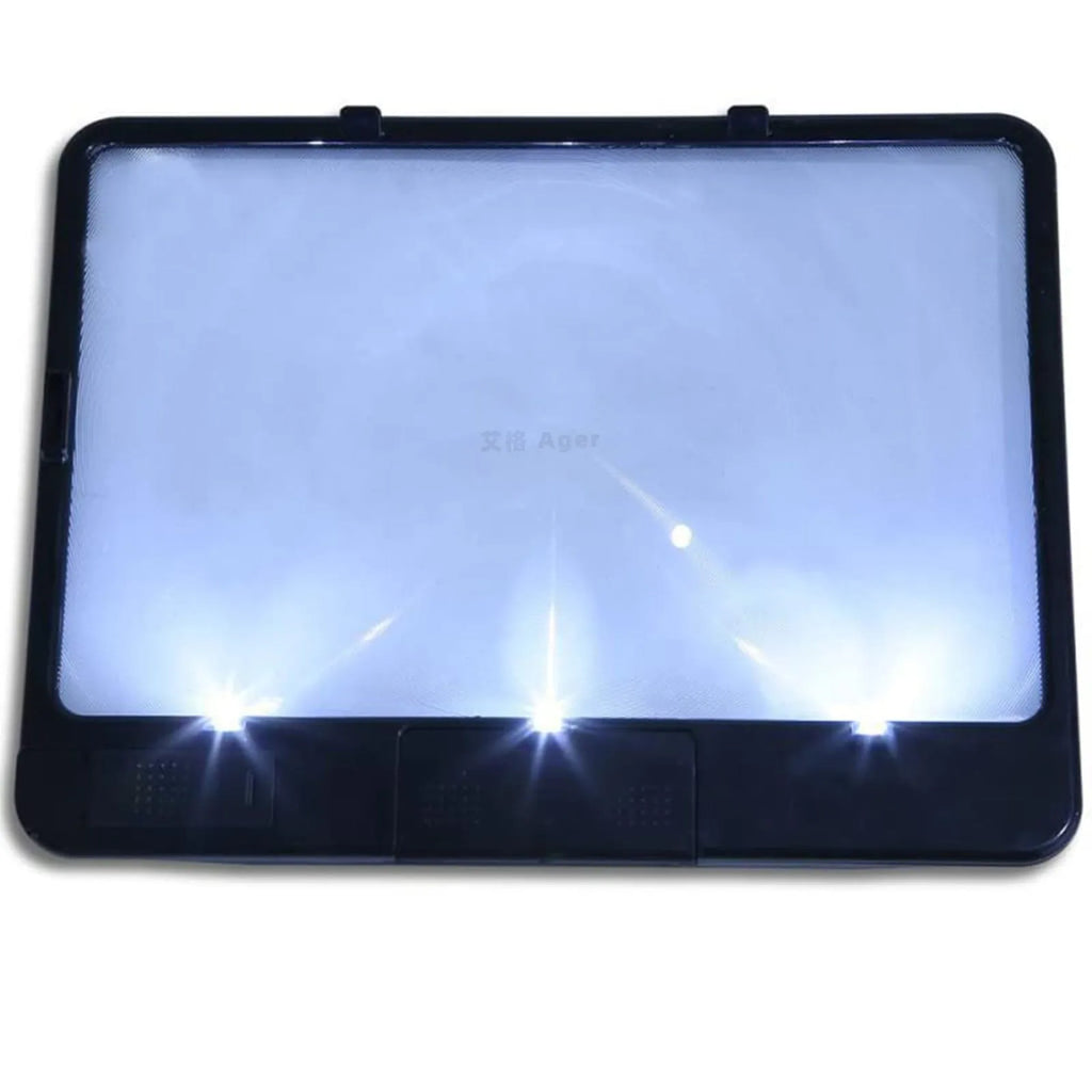 Black illuminated magnifying glass with 3x magnification and LED reading light on white background