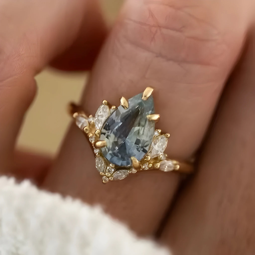 Gold-tone alloy floral ring with blue aquamarine-coloured crystal and diamond inlay for women