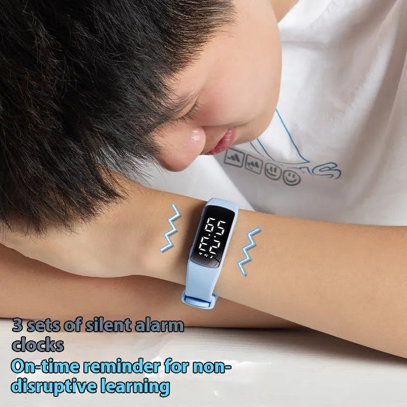 Smart electronic watch with LED display showing time, featuring vibration alarm and 50 metre waterproof rating with silicone strap