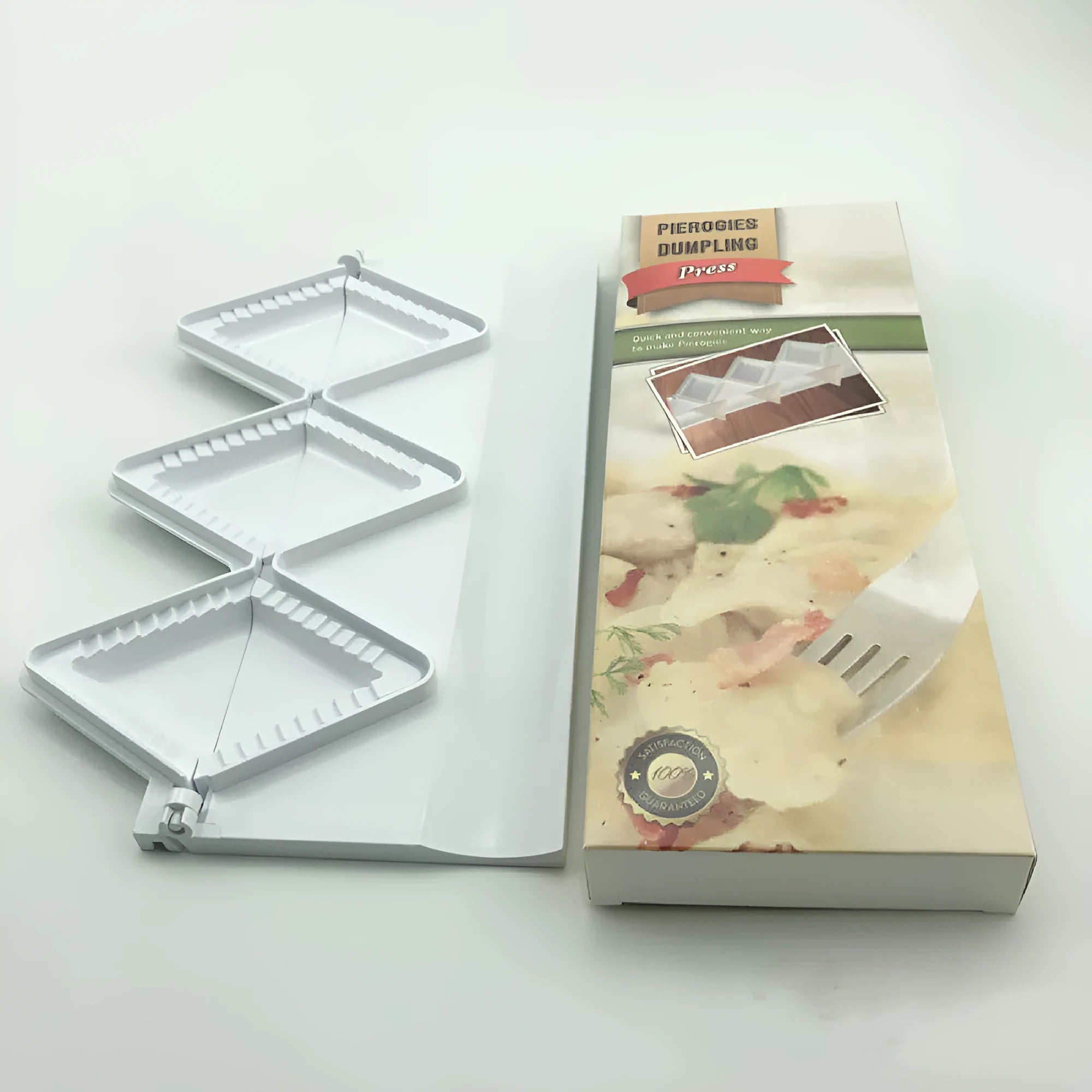 Pure white plastic dumpling maker 28.5cm length on a kitchen counter