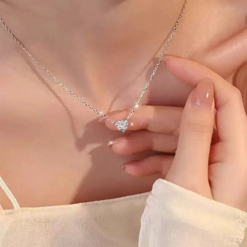 Women's simple silver-coloured heart necklace on a delicate chain.
