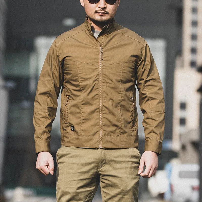 Man wearing brown Outdoor Tactics Assassin Jacket, a plaid-pattern polyester coat with a collar, shown outdoors.