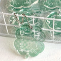 Acrylic four-leaf clover charm pendant keychain in blue, green, and mint colour options