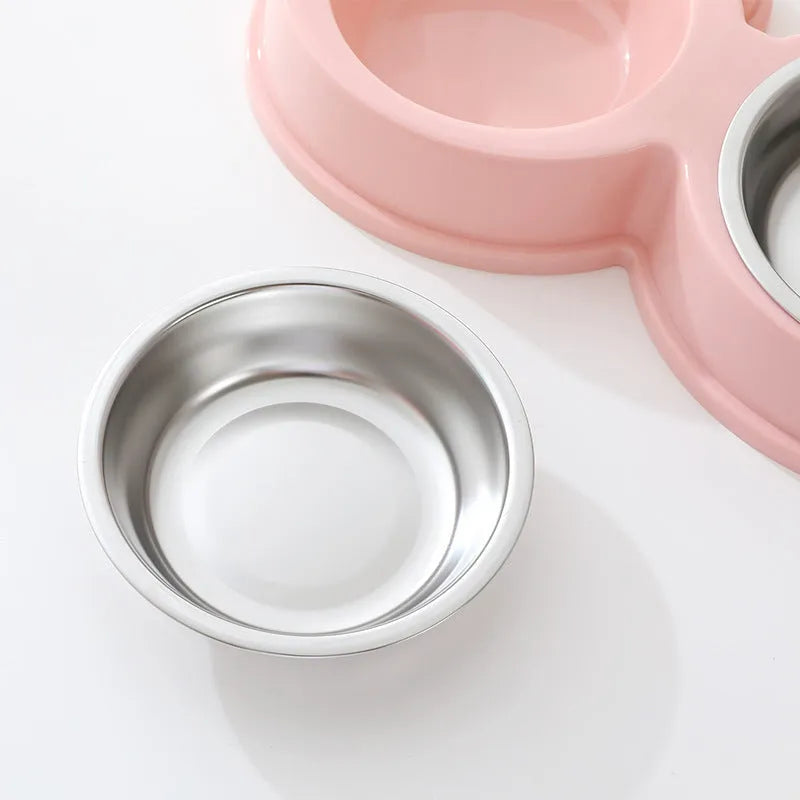 Stainless steel pet double bowl for food and water in blue, green, and pink colour options.
