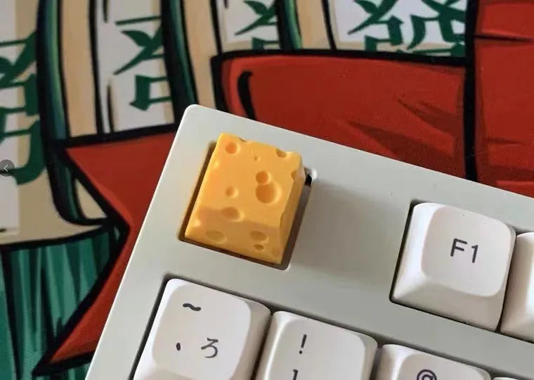 Yellow resin cheese keycap for mechanical keyboards with 3D design detail