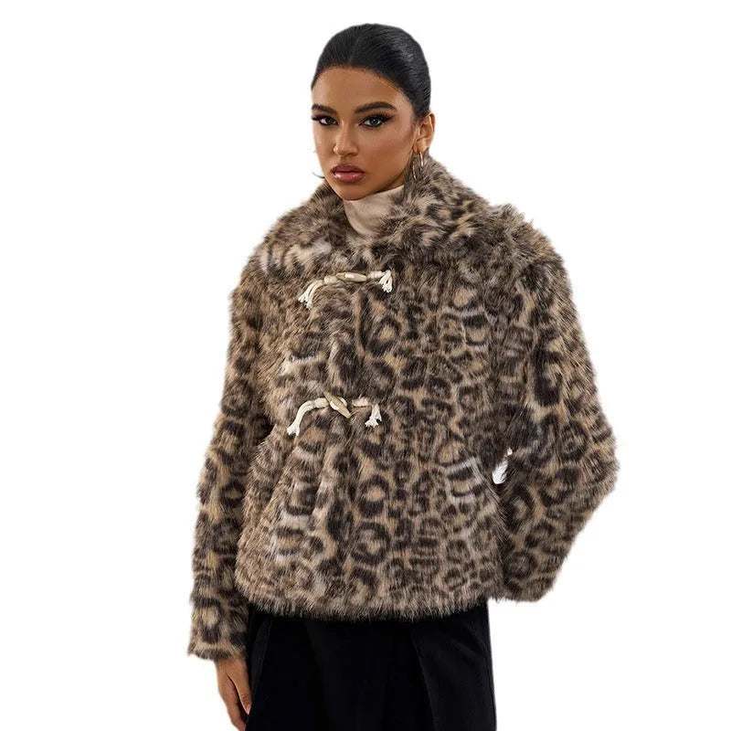 Women's leopard print polyester coat with a buckle lapel closure on a hanger