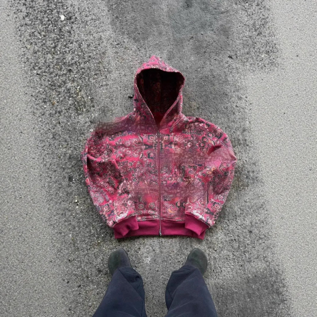 Man wearing a blue loose-fit zip hooded coat with the hood up, showcasing casual autumn style.