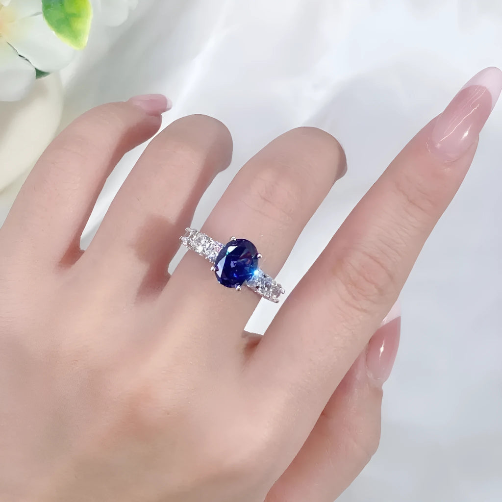 Sterling silver ring with heart-shaped ice flower cut zircon centrepiece on a hand.
