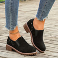 Women's light brown suede ankle boots with a low thick heel and elasticated ankle band.
