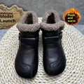 Women's winter slip-on ankle boots with round toe, low platform heel, in black synthetic leather with stitching detail