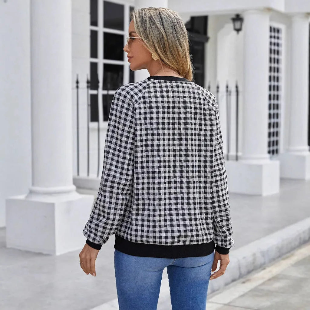 Black long sleeve pullover sweater with a Japanese sweet plaid and striped pattern.
