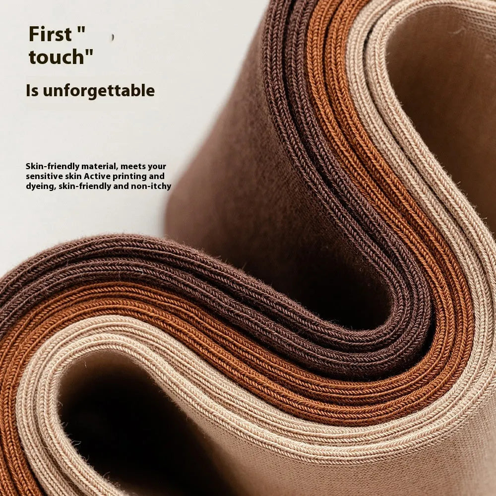 Five pairs of men's solid colour mid-calf socks made from combed cotton, shown in assorted colours.