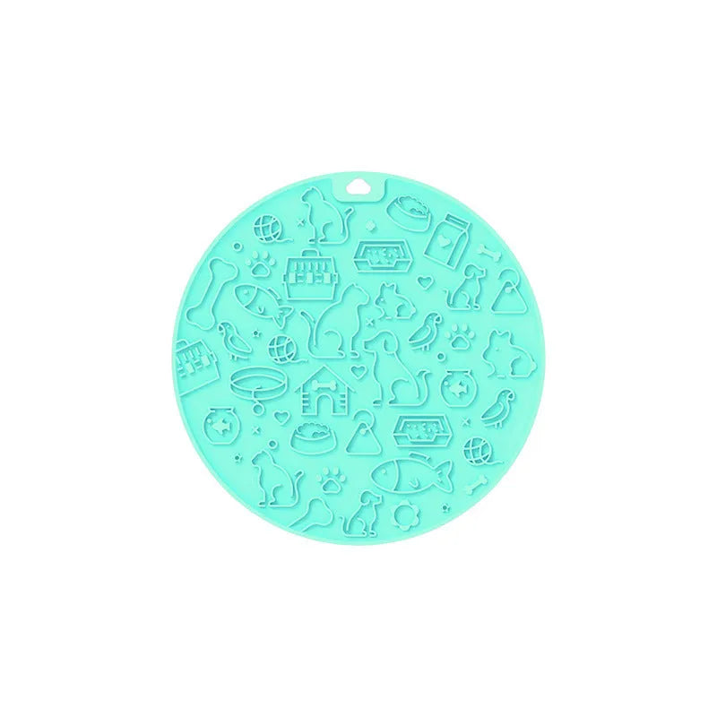 Round blue silicone pet licking mat with textured surface and white sucker on reverse.