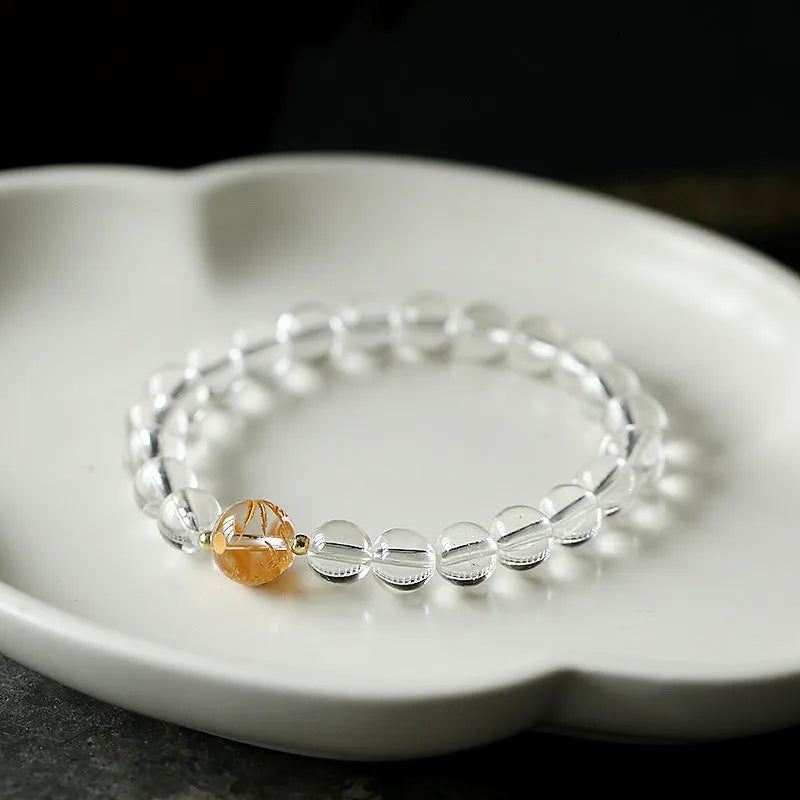 Unisex geometric bead bracelet with black obsidian agate and white crystal stones on a wrist