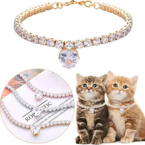 Gold rhinestone heart-shaped dog collar with bling design on a white background.