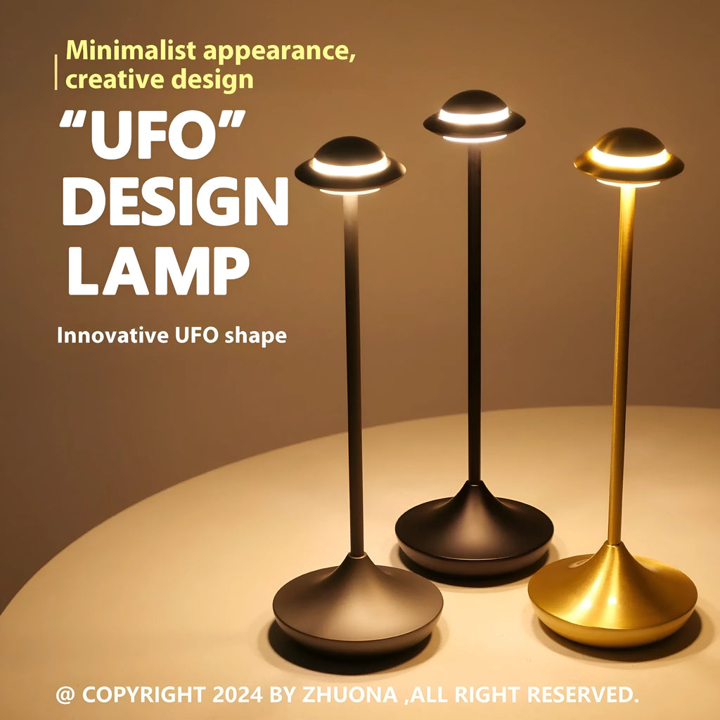 Modern UFO-shaped metal table lamp in black on a wooden desk, showing touch controls and soft glow.