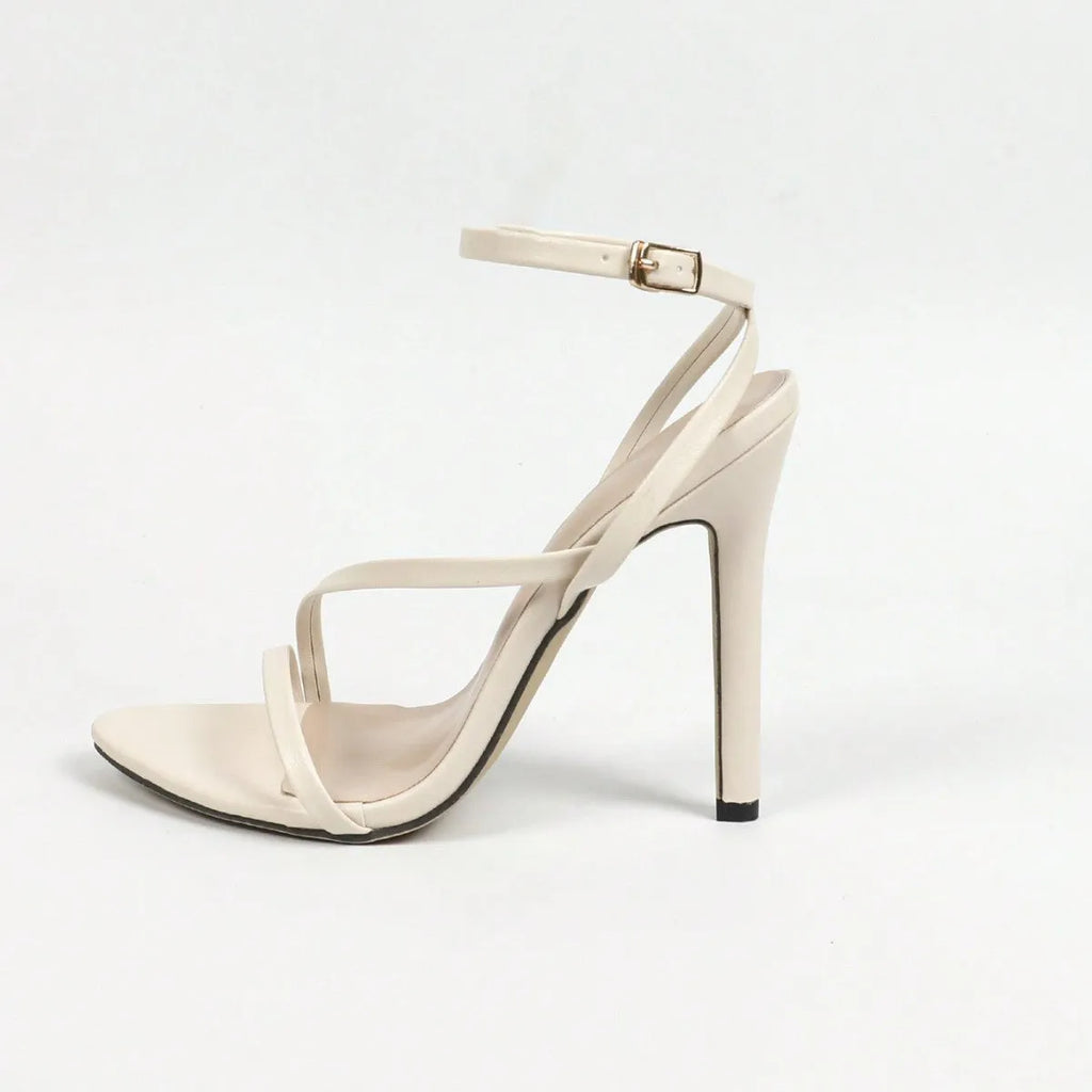 Women's gold high heels with multi-stripe cross ankle strap and open round toe.