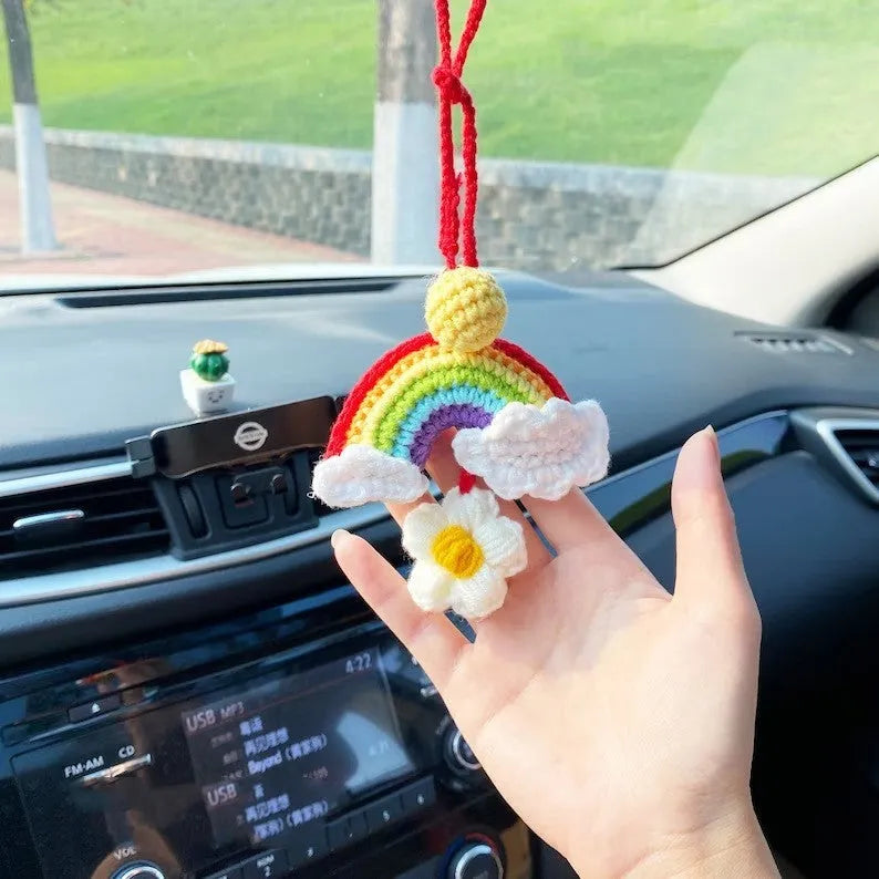 Handmade crocheted wool car pendant in avocado, pink rainbow, or red rainbow colour with cartoon flower design.