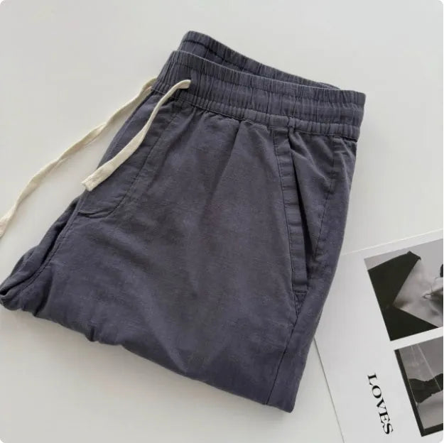 Men's loose straight leg casual trousers with drawstring waist in beige, black, green, grey, and navy blue colours