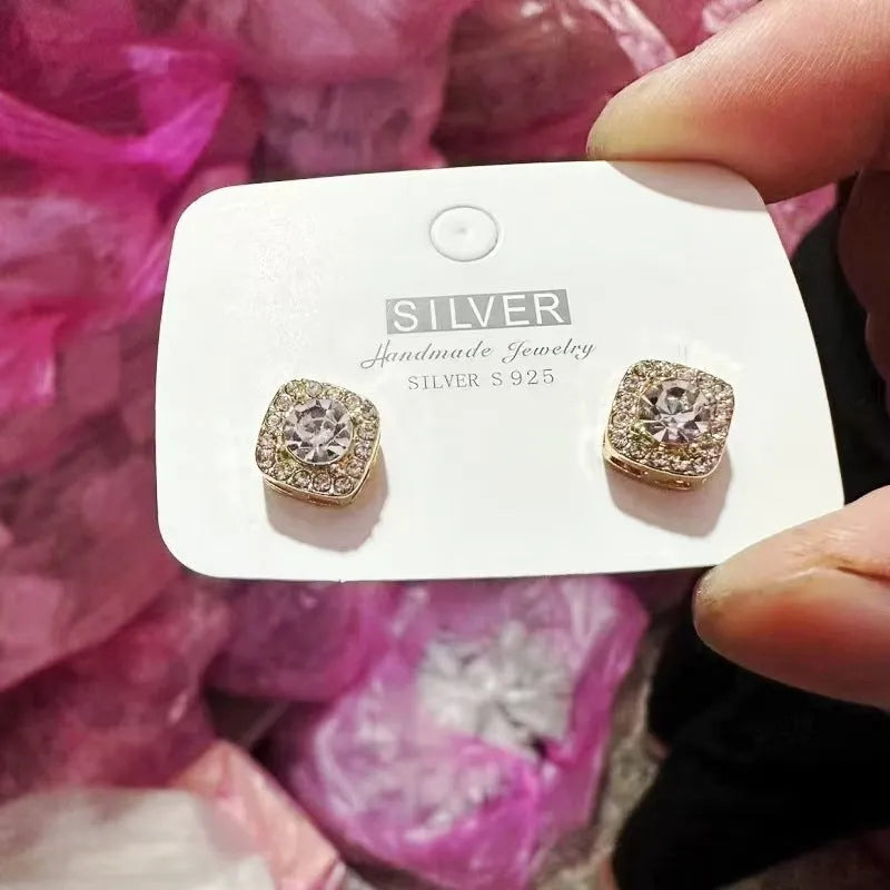 Square diamond earrings in geometric design, available in silver and gold colours for women.