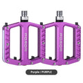 A pair of aluminium alloy bicycle pedals with integrated LED lights in purple colour
