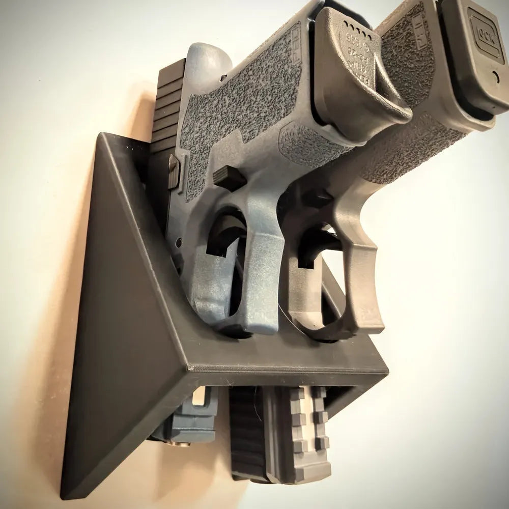 Black punk-style plastic pistol display stand for model guns