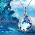 Close-up of a moonstone blue heart-shaped alloy pendant on a women's necklace chain.