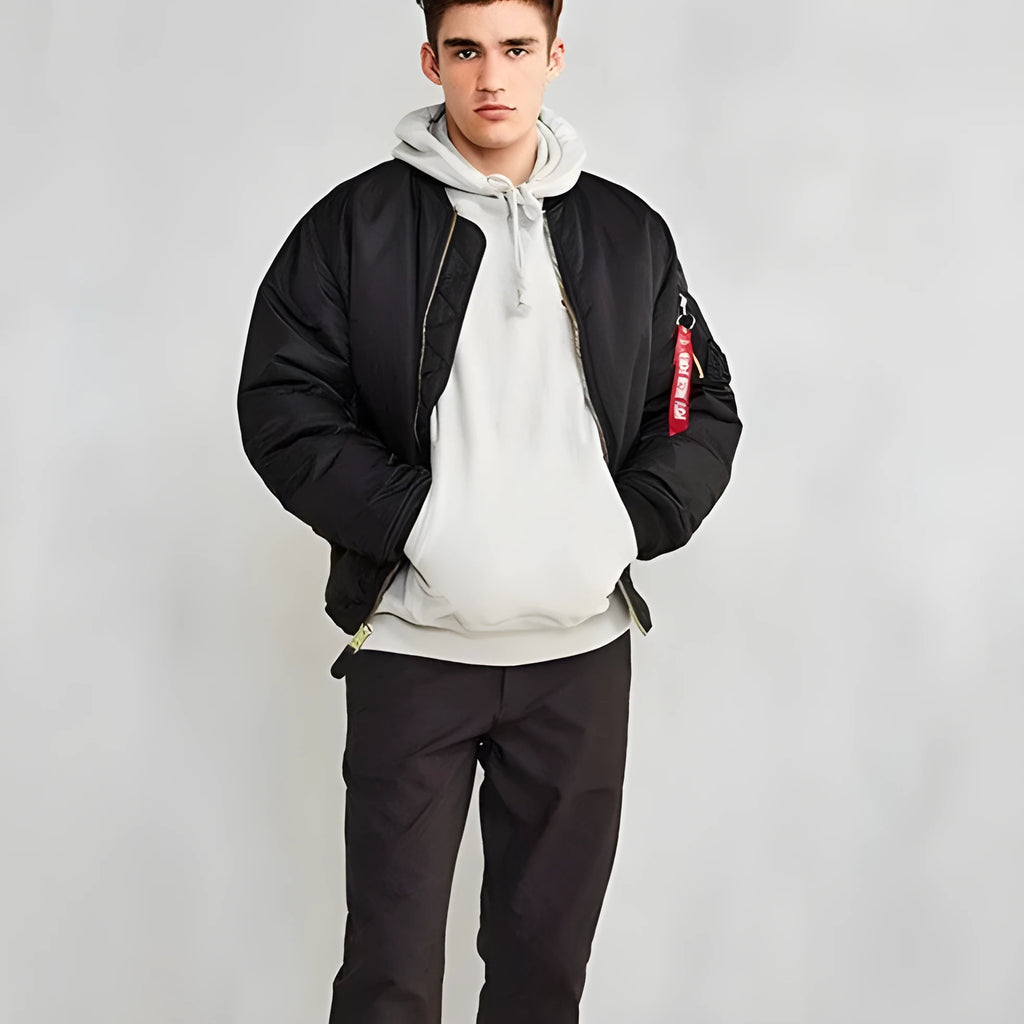 Men's army green cotton-padded pilot jacket with double-sided nylon construction on a hanger.