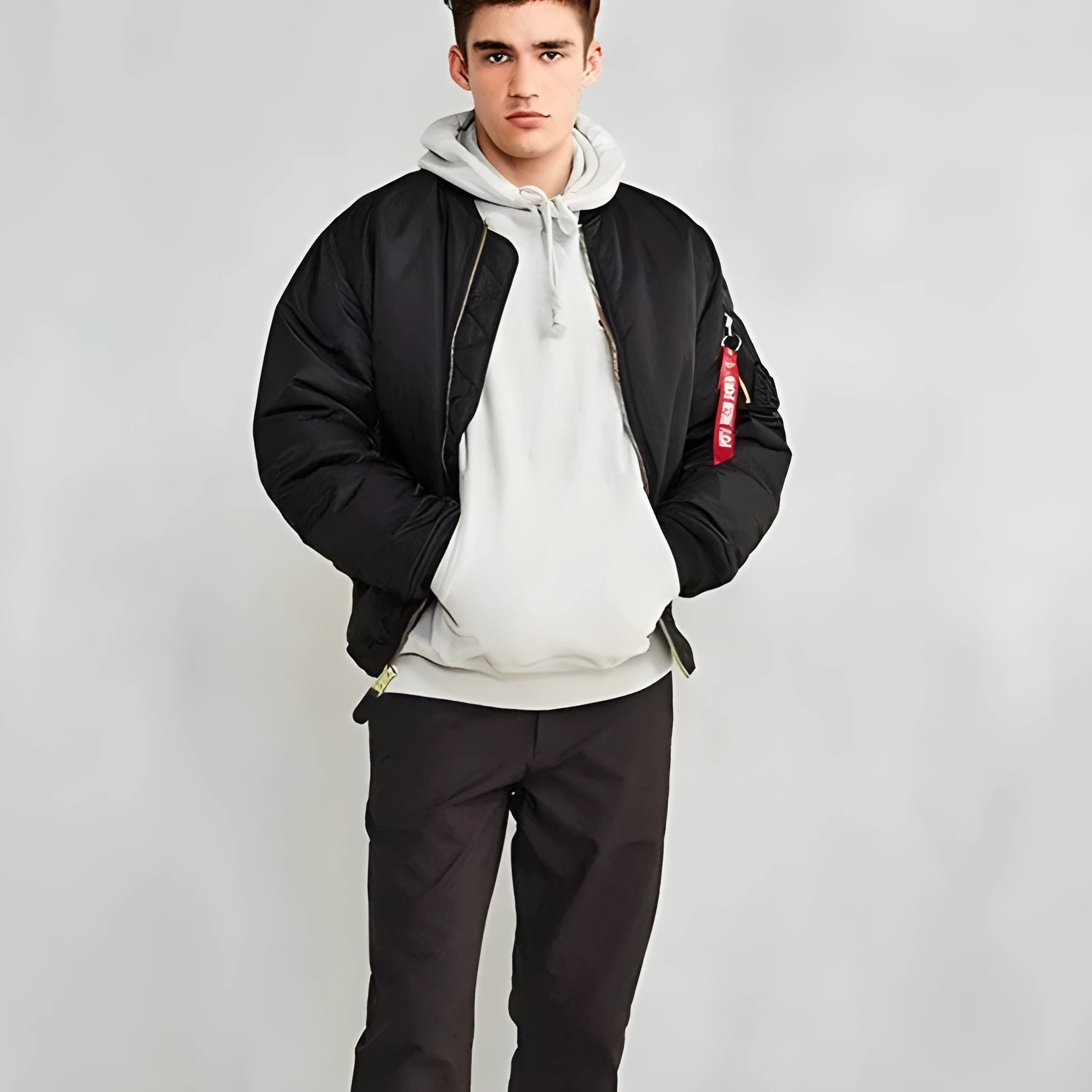 Men's army green cotton-padded pilot jacket with double-sided nylon construction on a hanger.