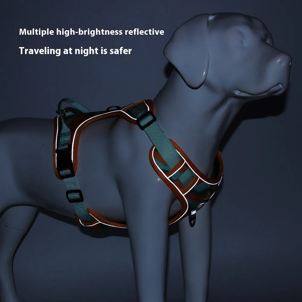 Reflective orange dog harness with chest and back rope attachments and a hand-holding lead.