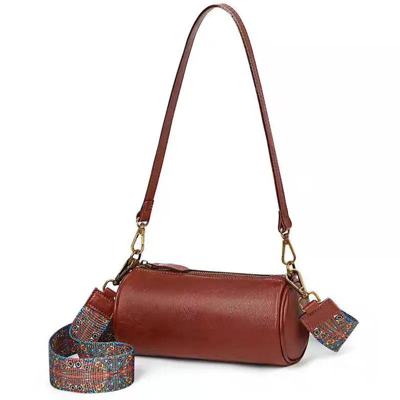Top layer cowhide leather round single-shoulder bag in caramel brown with wide strap and sewing thread details
