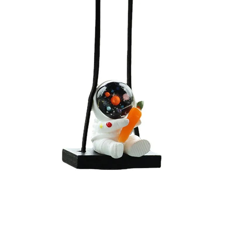 Resin cartoon astronaut car pendant in five designs: telescope, red flag, radish, headrest, and resting astronaut